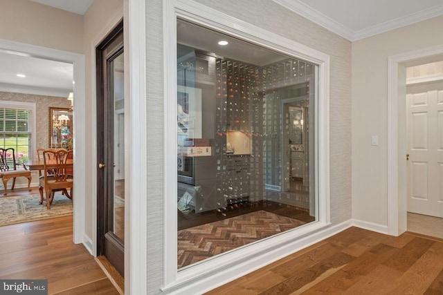 121 Eshelman Rd, Lancaster, PA 17601 - wine area featuring wood finished floors, ornamental molding, baseboards, and wallpapered walls