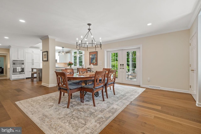 121 Eshelman Rd, Lancaster, PA 17601 - dining space with a chandelier, crown molding, wood finished floors, recessed lighting, and baseboards