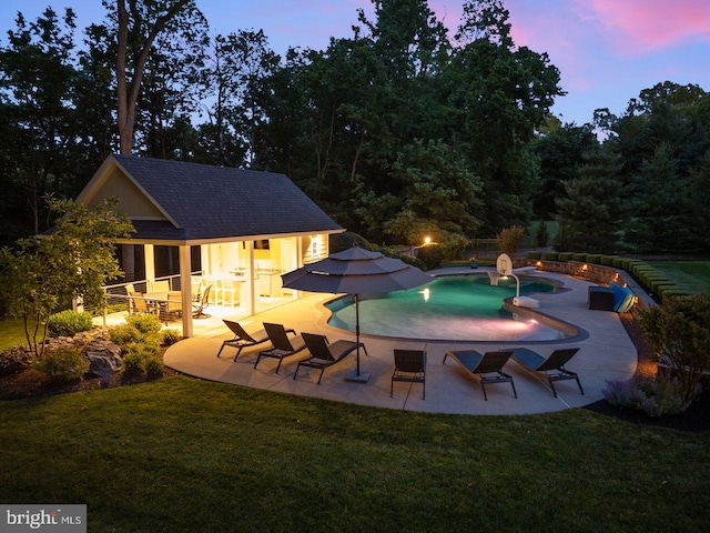 121 Eshelman Rd, Lancaster, PA 17601 - pool at dusk featuring a patio area, a yard, and an outbuilding