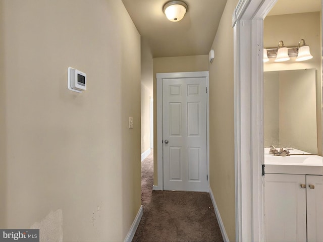225 S State St, Ephrata, PA 17522 - hallway with carpet floors, baseboards, and a sink