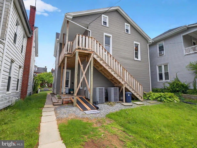 225 S State St, Ephrata, PA 17522 - rear view of property featuring central AC, a wooden deck, stairs, and a yard