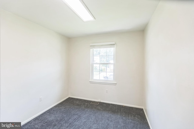7910 Polk St, Lanham, MD 20706 - empty room with dark colored carpet and baseboards