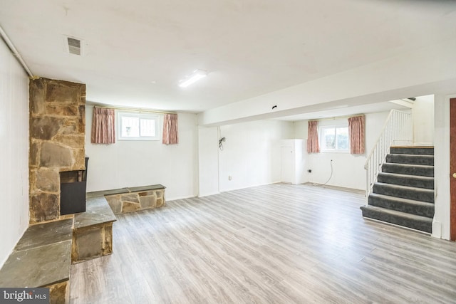 7910 Polk St, Lanham, MD 20706 - basement featuring wood finished floors, stairway, and a stone fireplace