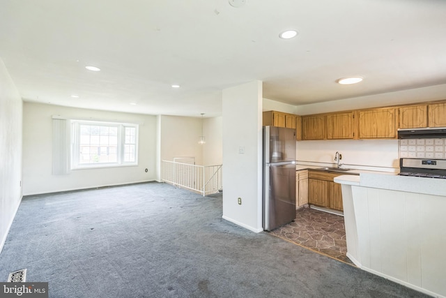 7910 Polk St, Lanham, MD 20706 - kitchen with appliances with stainless steel finishes, a sink, ventilation hood, dark colored carpet, and light countertops