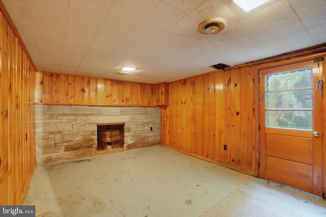 758 Rathton Rd, York, PA 17403 - basement featuring wood walls and a stone fireplace
