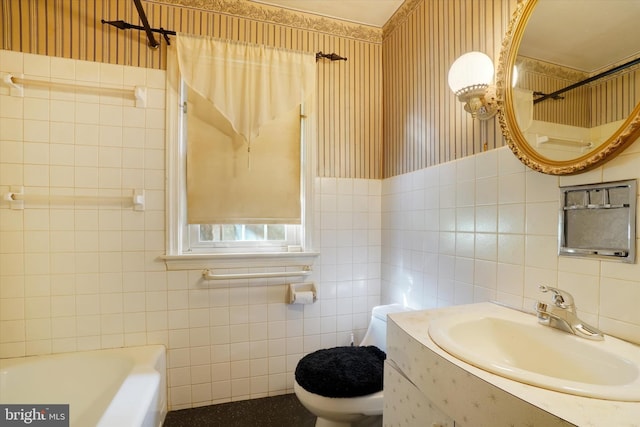 758 Rathton Rd, York, PA 17403 - bathroom featuring tile walls, wallpapered walls, a bathtub, toilet, and vanity