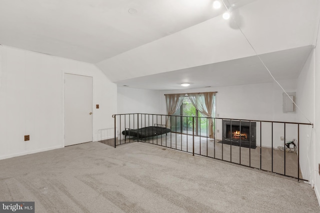 2339 Millennium Ln, Reston, VA 20191 - carpeted living area with vaulted ceiling and a lit fireplace