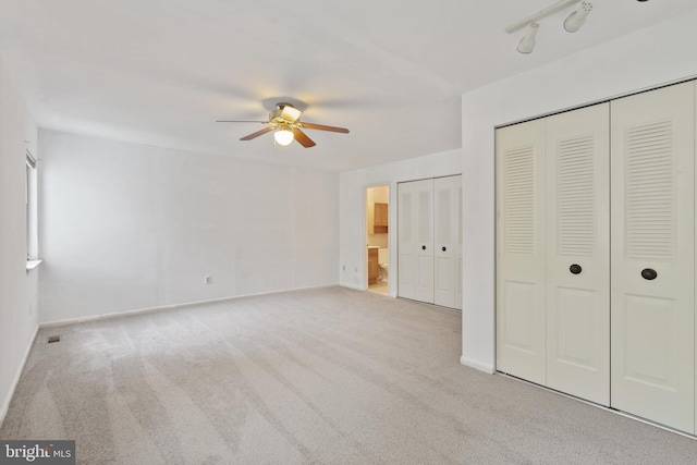2339 Millennium Ln, Reston, VA 20191 - unfurnished bedroom with carpet, baseboards, ensuite bath, and a ceiling fan