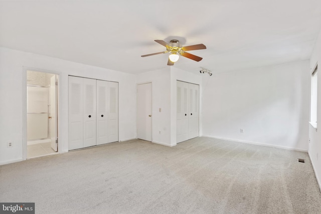2339 Millennium Ln, Reston, VA 20191 - unfurnished bedroom with carpet flooring, two closets, baseboards, and ensuite bathroom