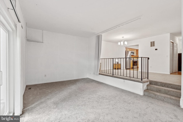 2339 Millennium Ln, Reston, VA 20191 - carpeted spare room with a chandelier and baseboards