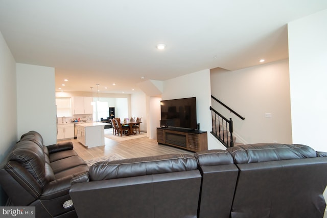 305 Shipyard Dr Unit 61, Cambridge, MD 21613 - living room with light wood-style flooring, stairs, and recessed lighting