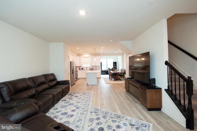 305 Shipyard Dr Unit 61, Cambridge, MD 21613 - living area featuring light wood-style flooring, recessed lighting, and stairs