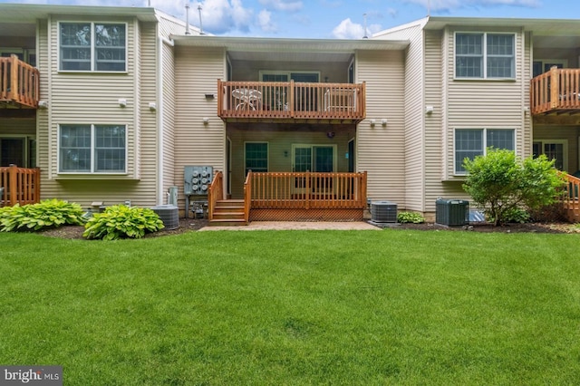 136 Chalkboard Ct, Moorestown, NJ 08057 - back of property with a balcony, a lawn, and central AC