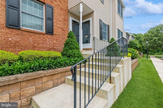 136 Chalkboard Ct, Moorestown, NJ 08057 - doorway to property featuring brick siding and a yard