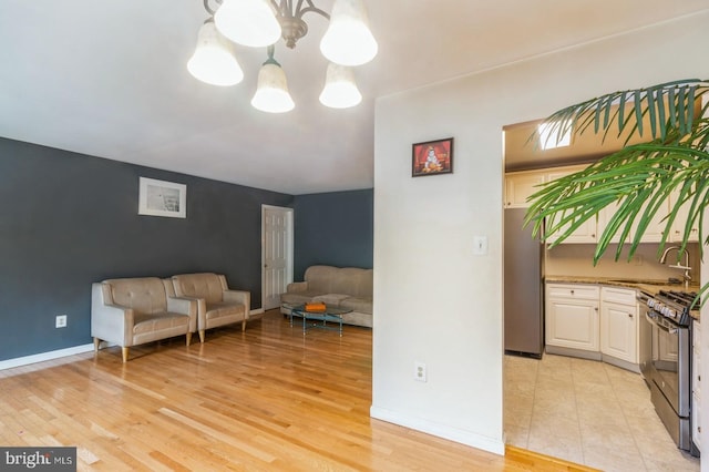 136 Chalkboard Ct, Moorestown, NJ 08057 - sitting room featuring a chandelier, light wood-type flooring, and baseboards