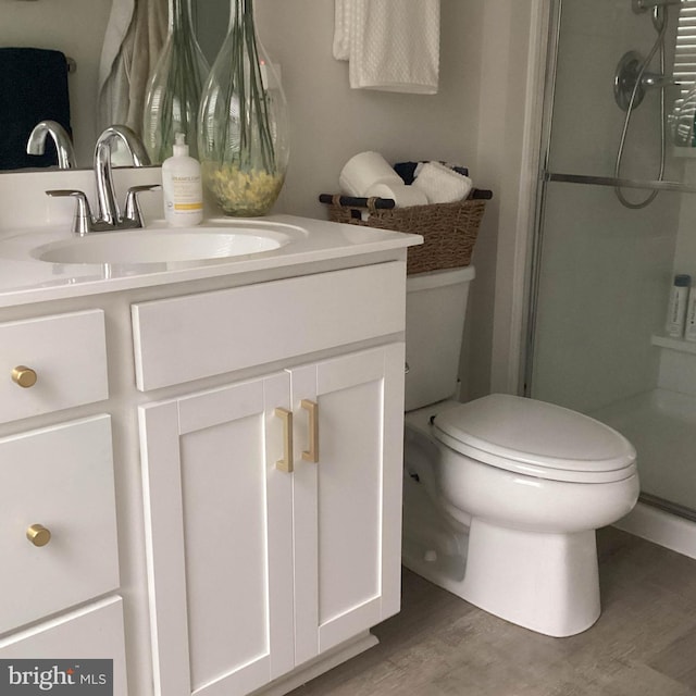 212 Bowline Dr, Cambridge, MD 21613 - full bath featuring toilet, a shower stall, wood finished floors, and vanity