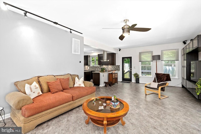 27 Athens Ln, Ruther Glen, VA 22546 - living room featuring a ceiling fan and baseboards
