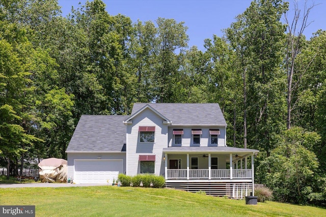 27 Athens Ln, Ruther Glen, VA 22546 - view of front of home with a porch, a front yard, a garage, and driveway
