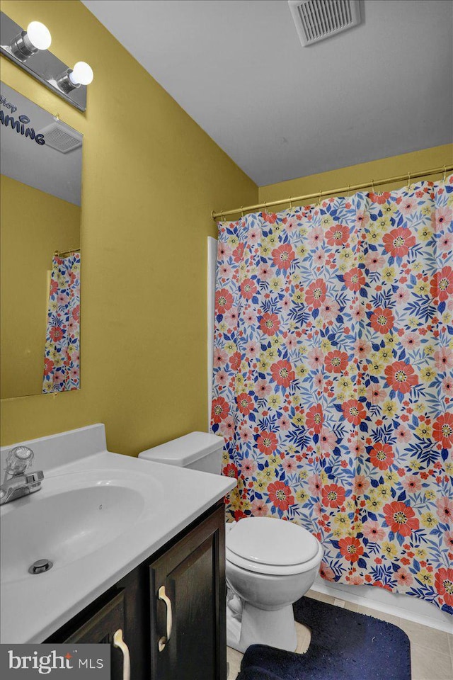 69 Calais Dr, Reading, PA 19605 - full bath featuring vanity, toilet, tile patterned floors, and a shower with curtain
