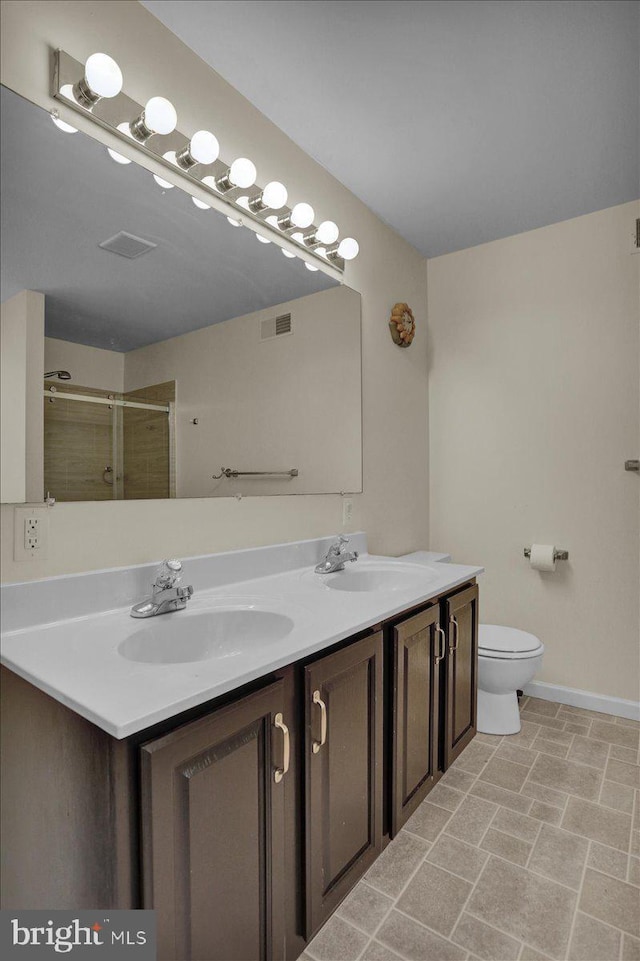 69 Calais Dr, Reading, PA 19605 - full bath featuring double vanity, tiled shower, toilet, and baseboards