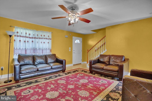 69 Calais Dr, Reading, PA 19605 - living room with stairway, ceiling fan, and baseboards