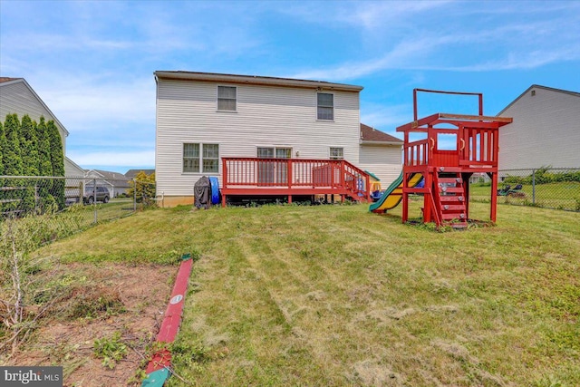 69 Calais Dr, Reading, PA 19605 - rear view of property featuring a playground and a wooden deck