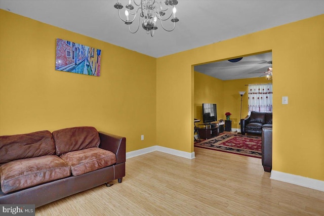 69 Calais Dr, Reading, PA 19605 - living area with baseboards, a chandelier, wood finished floors, and a ceiling fan