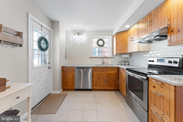 812 E Haverford Rd, Bryn Mawr, PA 19010 - kitchen featuring stainless steel appliances, under cabinet range hood, a sink, and tasteful backsplash