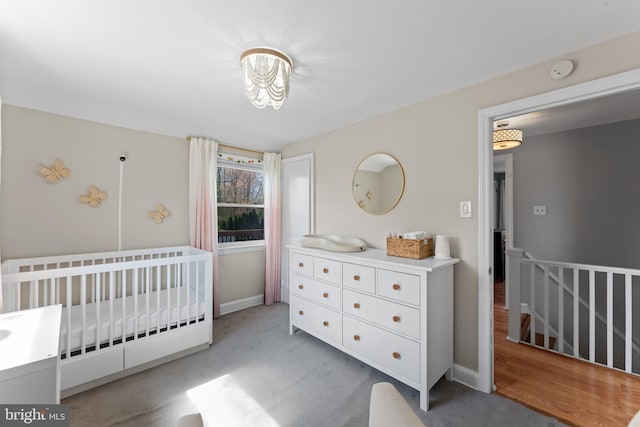 812 E Haverford Rd, Bryn Mawr, PA 19010 - carpeted bedroom featuring a nursery area and baseboards