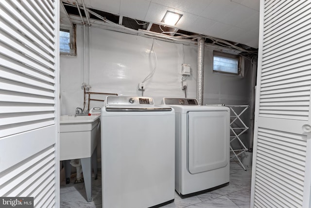 812 E Haverford Rd, Bryn Mawr, PA 19010 - washroom with independent washer and dryer and light marble finish floors