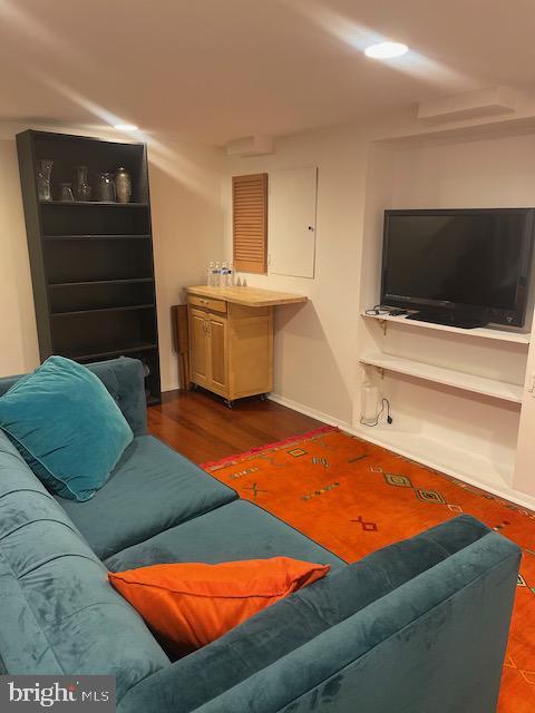 3936 NE Blaine St NE, Washington, DC 20019 - living area featuring baseboards and wood finished floors