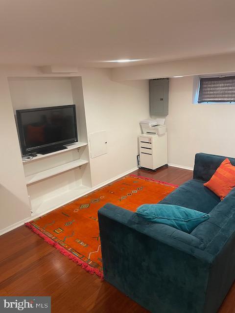 3936 NE Blaine St NE, Washington, DC 20019 - living room with electric panel, wood finished floors, and baseboards