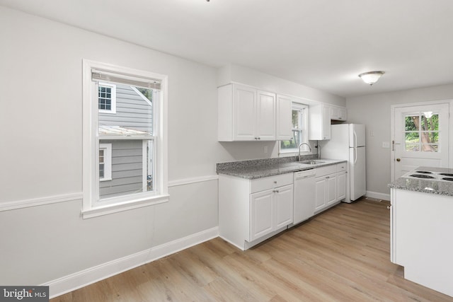509 W Cork St, Winchester, VA 22601 - kitchen featuring white appliances, baseboards, and light wood-type flooring
