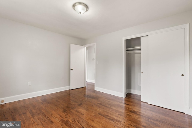 509 W Cork St, Winchester, VA 22601 - unfurnished bedroom featuring wood finished floors, a closet, and baseboards