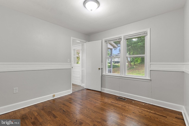 509 W Cork St, Winchester, VA 22601 - empty room featuring baseboards and dark wood-type flooring