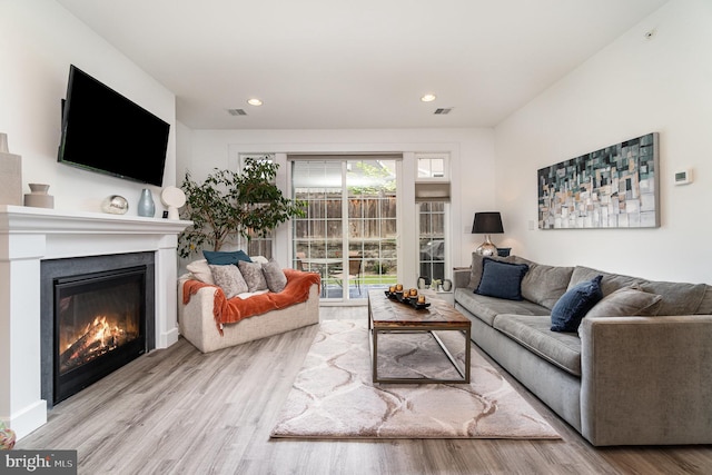 3209 Haley Way, Mechanicsburg, PA 17055 - living room with wood finished floors, a glass covered fireplace, and recessed lighting