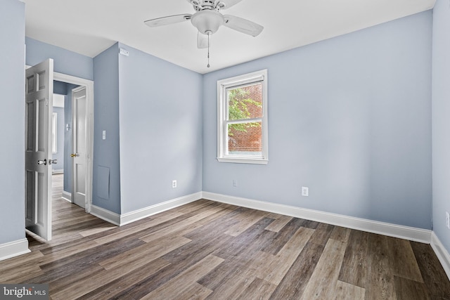 821 E Jeffrey St, Baltimore, MD 21225 - spare room featuring wood finished floors, baseboards, and a ceiling fan