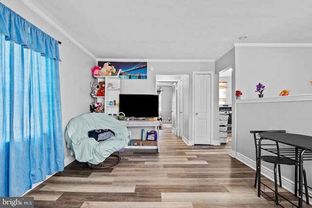 821 E Jeffrey St, Baltimore, MD 21225 - living room with ornamental molding, wood finished floors, and baseboards