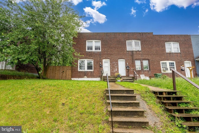 821 E Jeffrey St, Baltimore, MD 21225 - townhome / multi-family property with brick siding and stairway