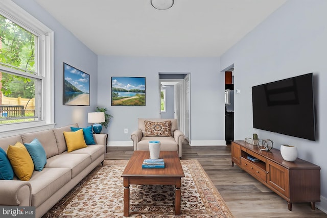 821 E Jeffrey St, Baltimore, MD 21225 - living area with light wood-style floors and baseboards