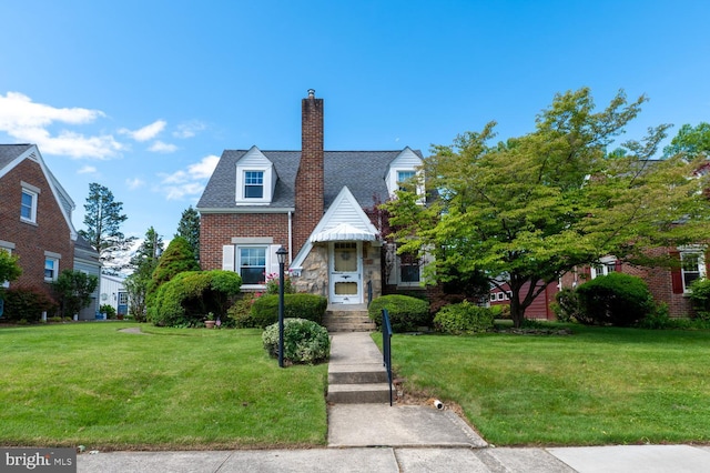 550 N 2nd St, Emmaus, PA 18049 - view of front of home featuring a front yard, a chimney, and stone siding
