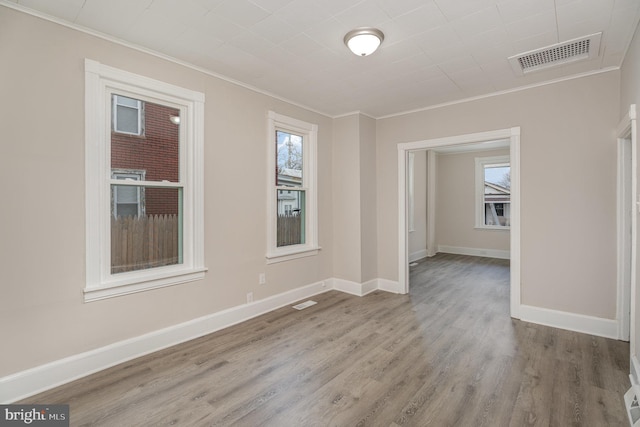 17 Umberto Ave, New Cumberland, PA 17070 - spare room featuring ornamental molding, wood finished floors, and baseboards