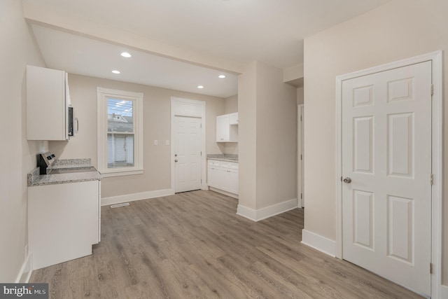 17 Umberto Ave, New Cumberland, PA 17070 - kitchen with range, white cabinets, light wood-style flooring, baseboards, and recessed lighting