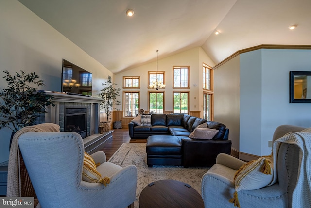 1874 Roundtop Rd, Wellsboro, PA 16901 - living area featuring lofted ceiling, wood finished floors, a chandelier, and a tile fireplace