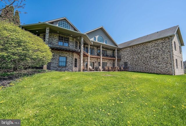 1874 Roundtop Rd, Wellsboro, PA 16901 - rear view of property featuring a lawn, brick siding, and a balcony