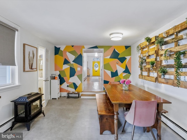 25 E Potomac St, Williamsport, MD 21795 - dining area with a baseboard heating unit and a wood stove