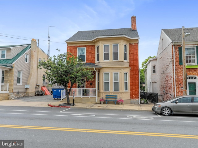 25 E Potomac St, Williamsport, MD 21795 - view of front facade featuring a chimney and brick siding