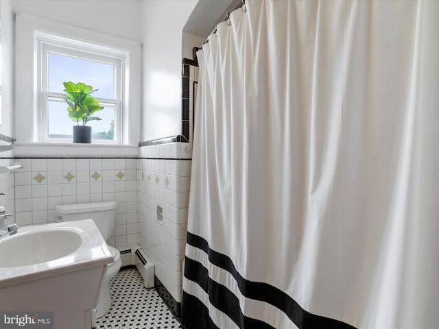 25 E Potomac St, Williamsport, MD 21795 - full bath featuring toilet, baseboard heating, wainscoting, tile walls, and vanity