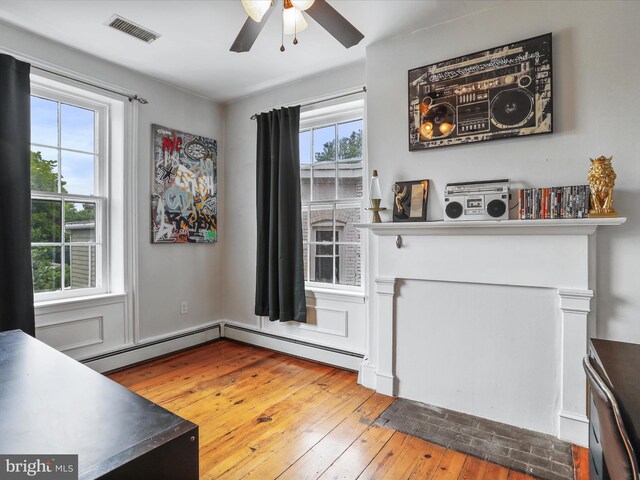 25 E Potomac St, Williamsport, MD 21795 - unfurnished dining area with healthy amount of natural light, ceiling fan, and hardwood / wood-style flooring