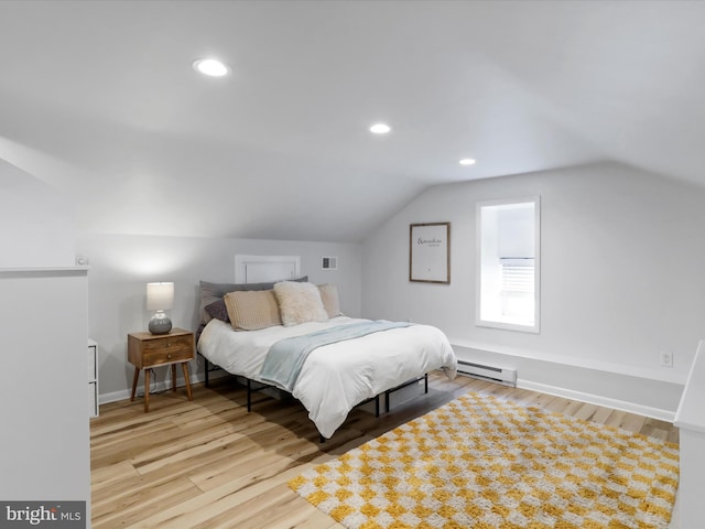 25 E Potomac St, Williamsport, MD 21795 - bedroom with a baseboard heating unit, lofted ceiling, wood finished floors, recessed lighting, and baseboards